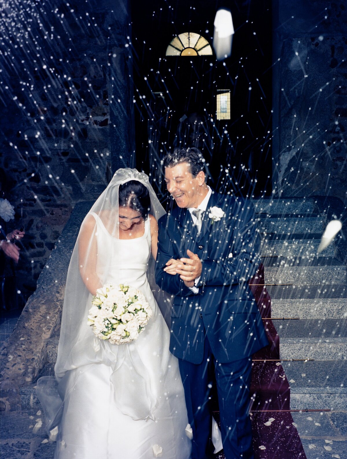 Wedding Photographer - Marian -Novara - throwing rice to the newlyweds 
