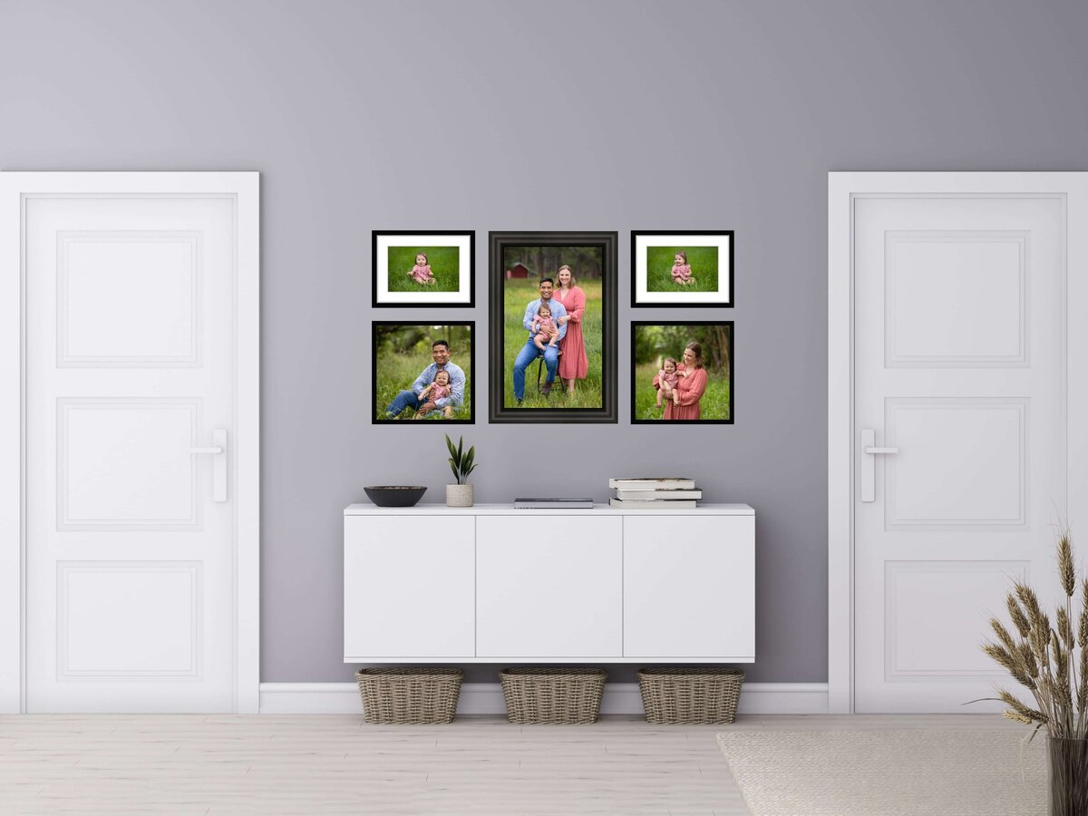 collection of framed canvases displaying pictures of a  family hanging on a hallway wall between two doors