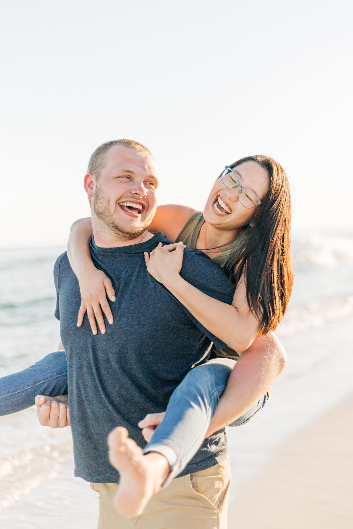 guy giving girl piggy back ride