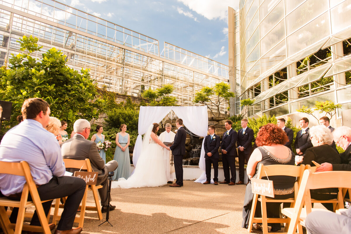 wedding ceremony behind rainforest room at phipps conservatory