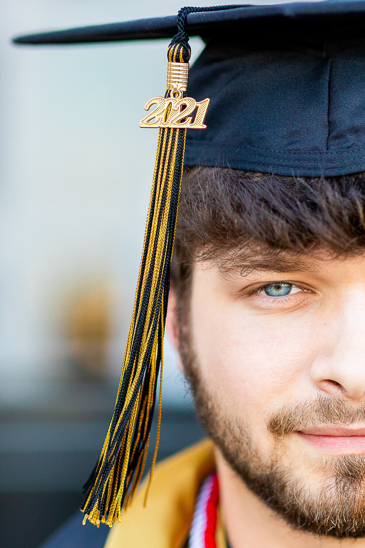 Close up of a senior male in his cap with a tassel