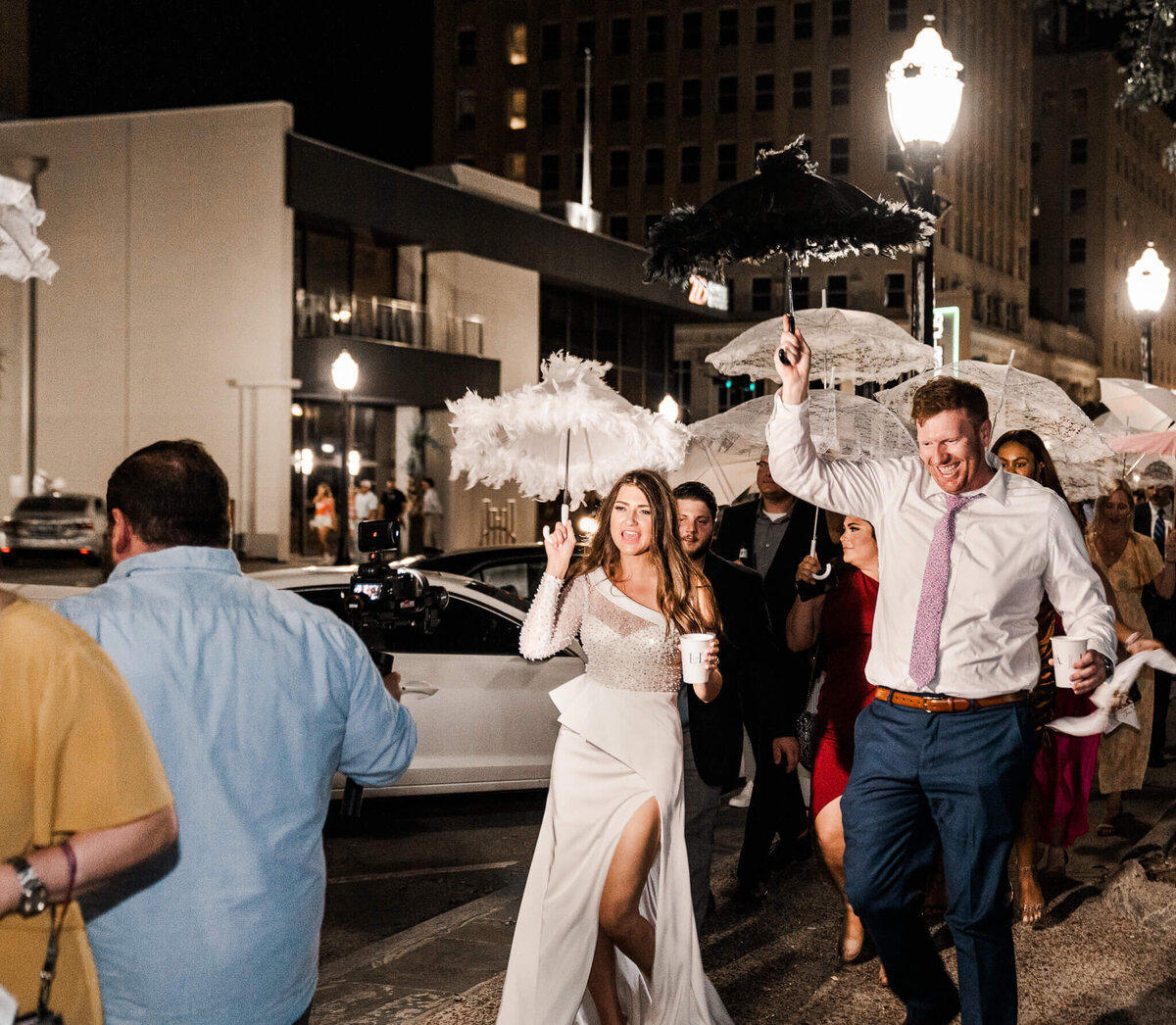 Downtown-Mobile-Alabama-Wedding-Photographer-Videographer-Second-Line-Society-Bride-Groom-Walking-Crop