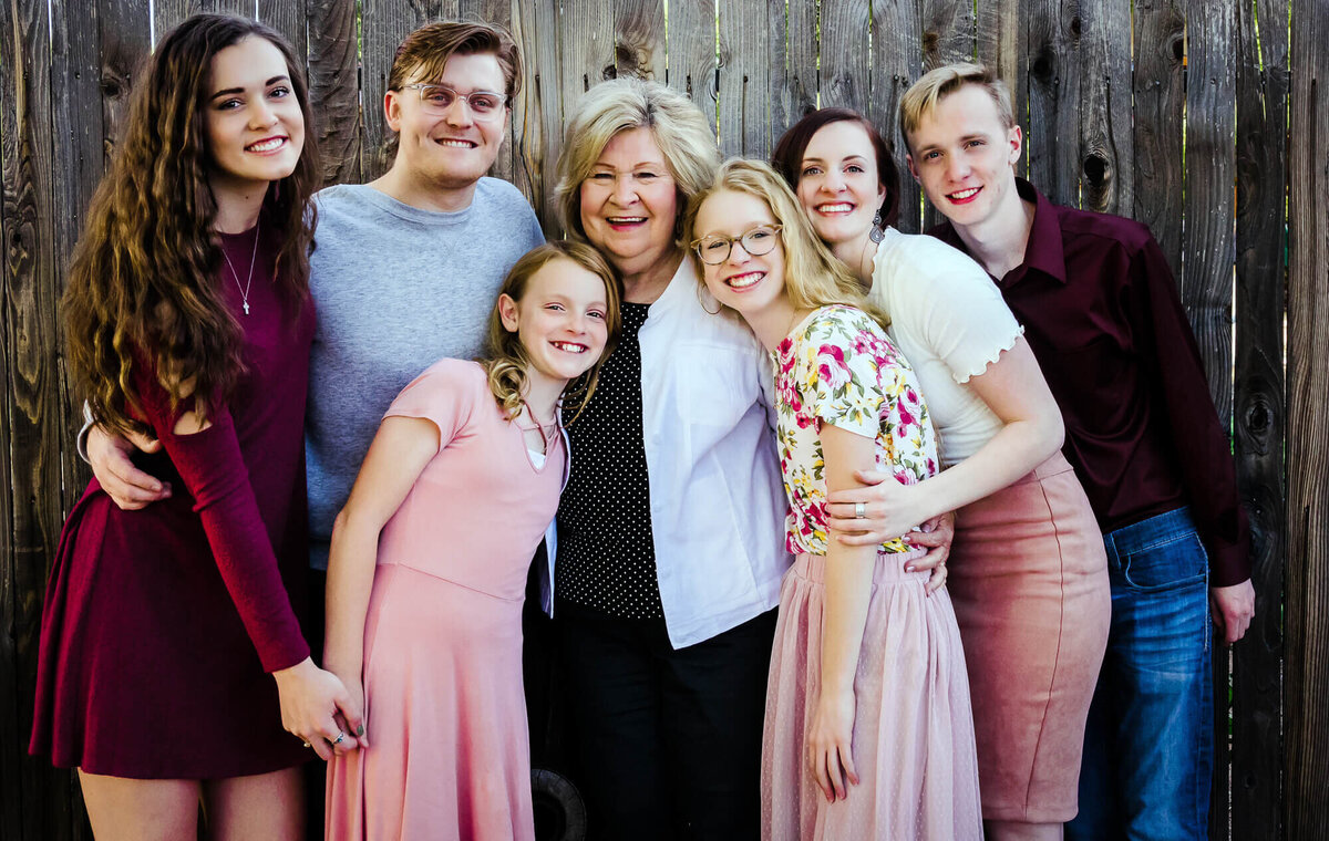 Grandmother poses with all her grandkids for Prescott family photographer Melissa Byrne