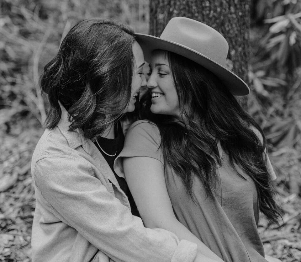 young lesbian couple engaged and happy outdoor session by maryland couples photographer