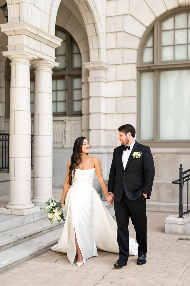 Bride and groom holding hands