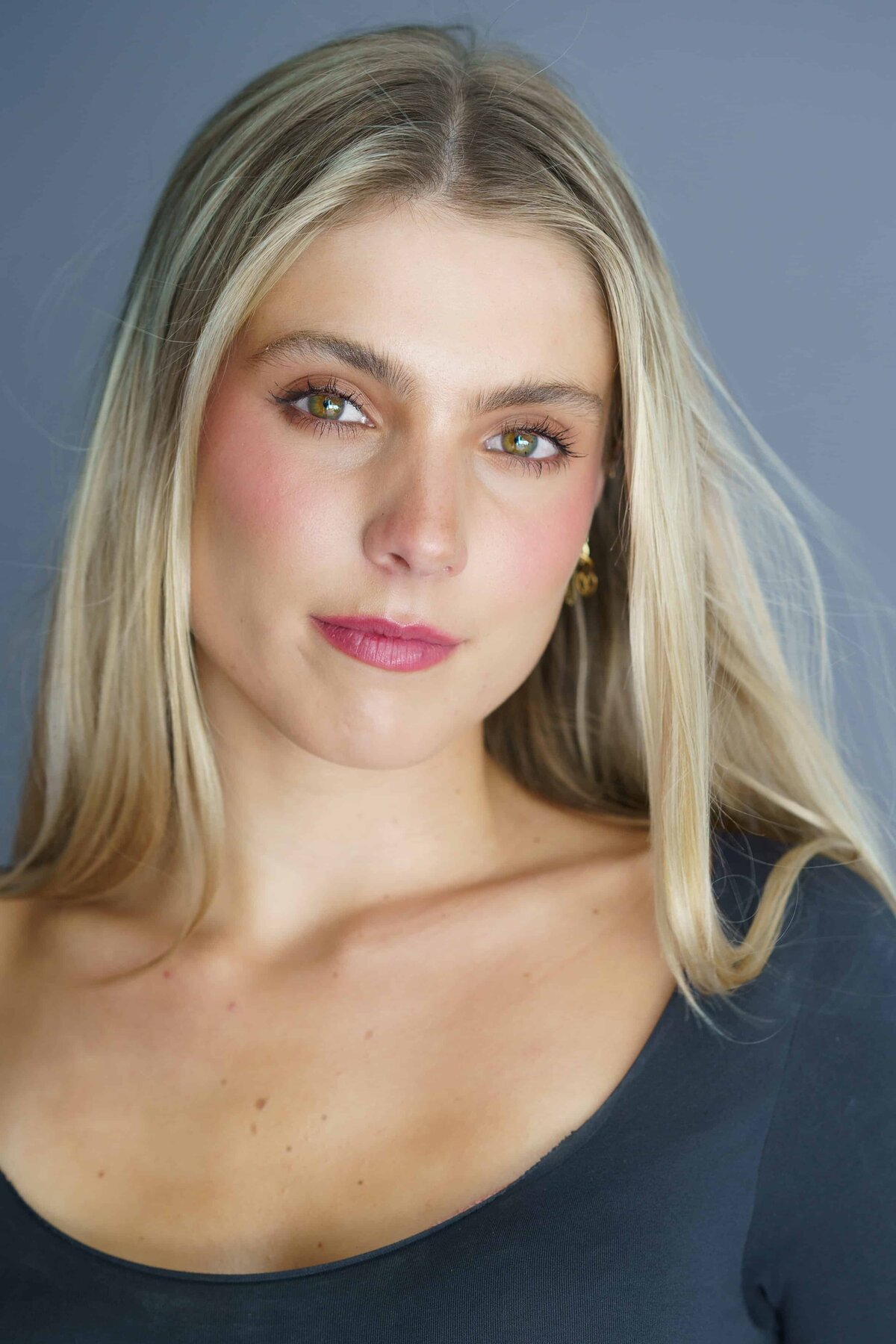 Close up headshot of a beautiful young woman with long hair