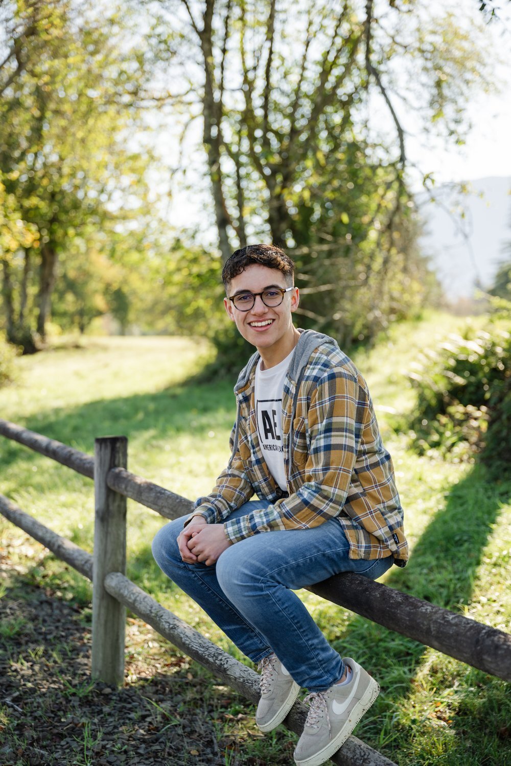 cedarcrest  high school senior sitting on fence