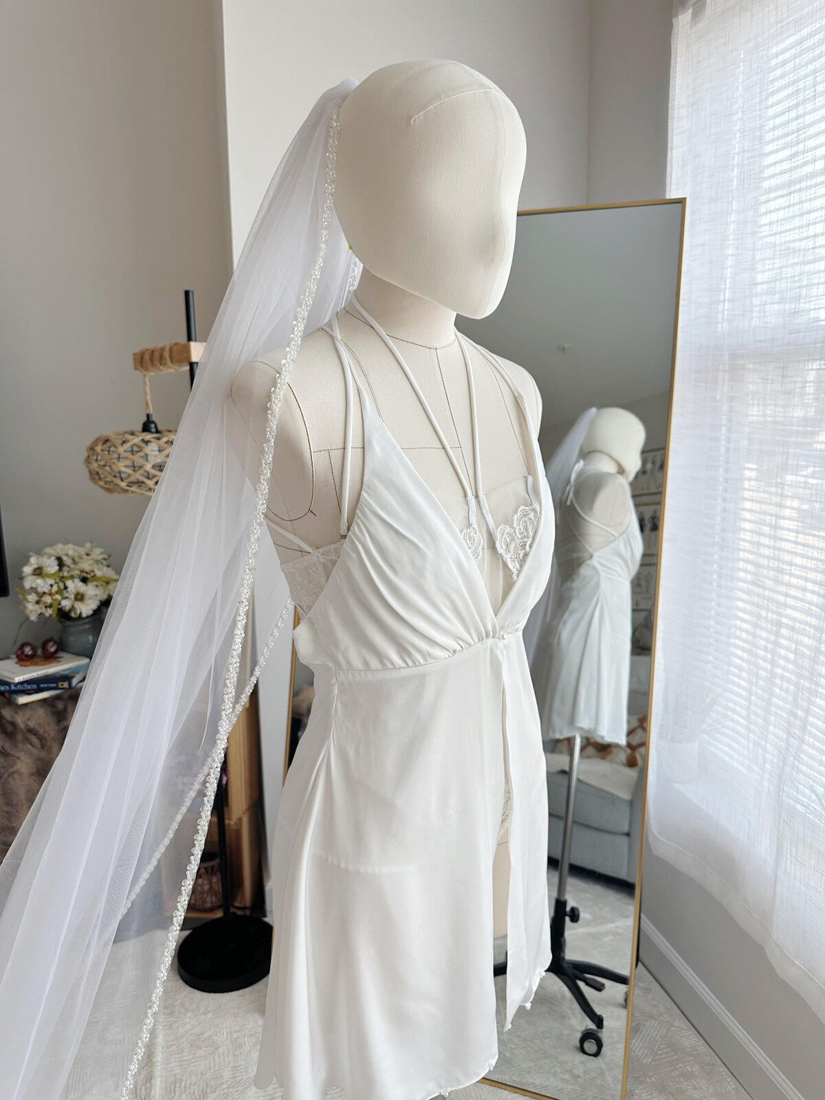 Beaded bridal veil with dreamy sheer texture and comb attachment
