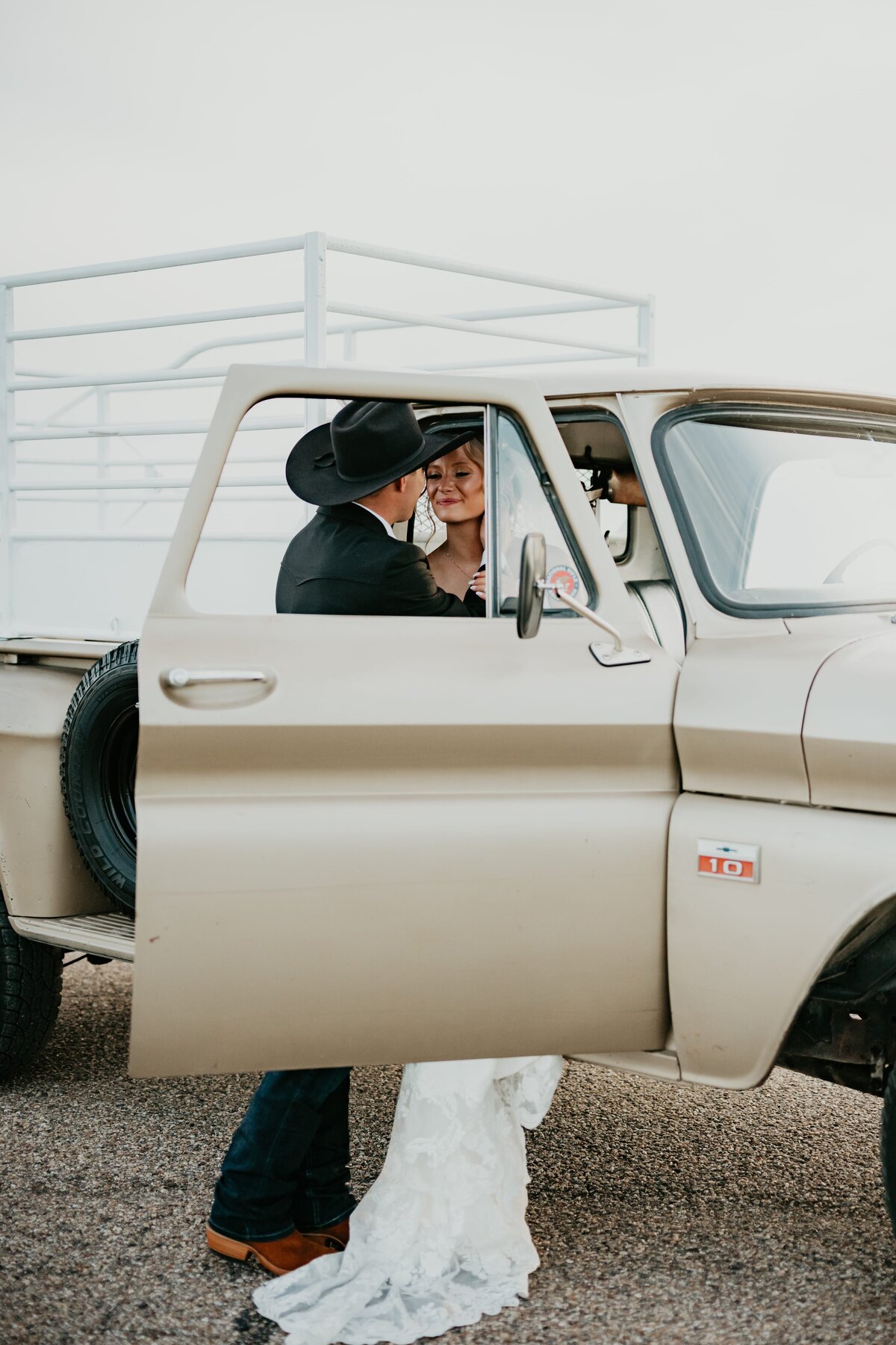 bride and groom standing by old pickup truck, texas panhandle wedding photography 