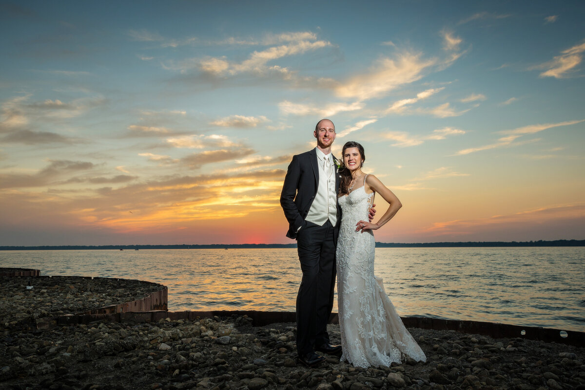 Bride and groom at sunset by Presque Isle Bay.