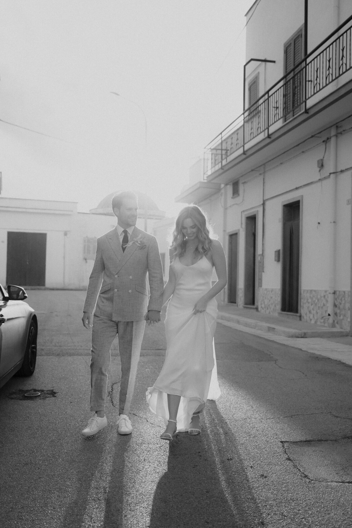 Bride-and-groom-walking-the-streets-of-puglia
