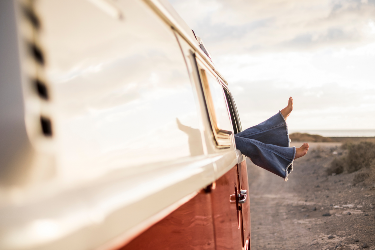 Entrepreneurial freedom symbolized by a van parked in nature, representing the clarity, autonomy, and lifestyle flexibility achieved through strategic business growth and intentional planning.