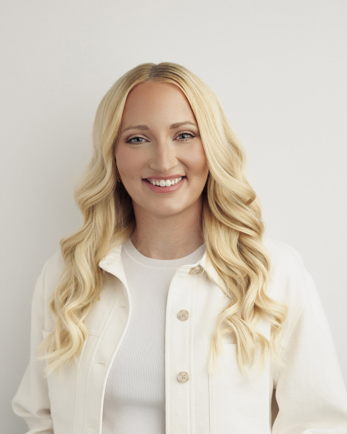 Modern headshot with soft studio lighting for a confident woman seeking updated branding images.