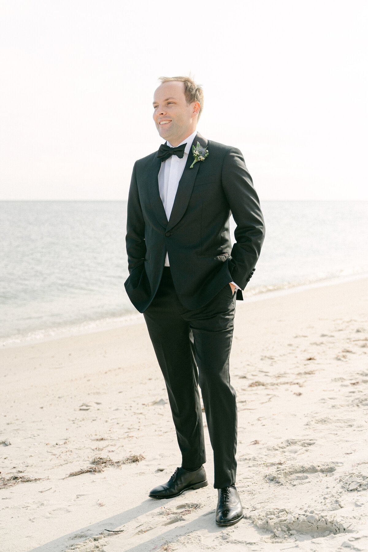 Groom on the beach in Hyannis Port for a a Cod wedding