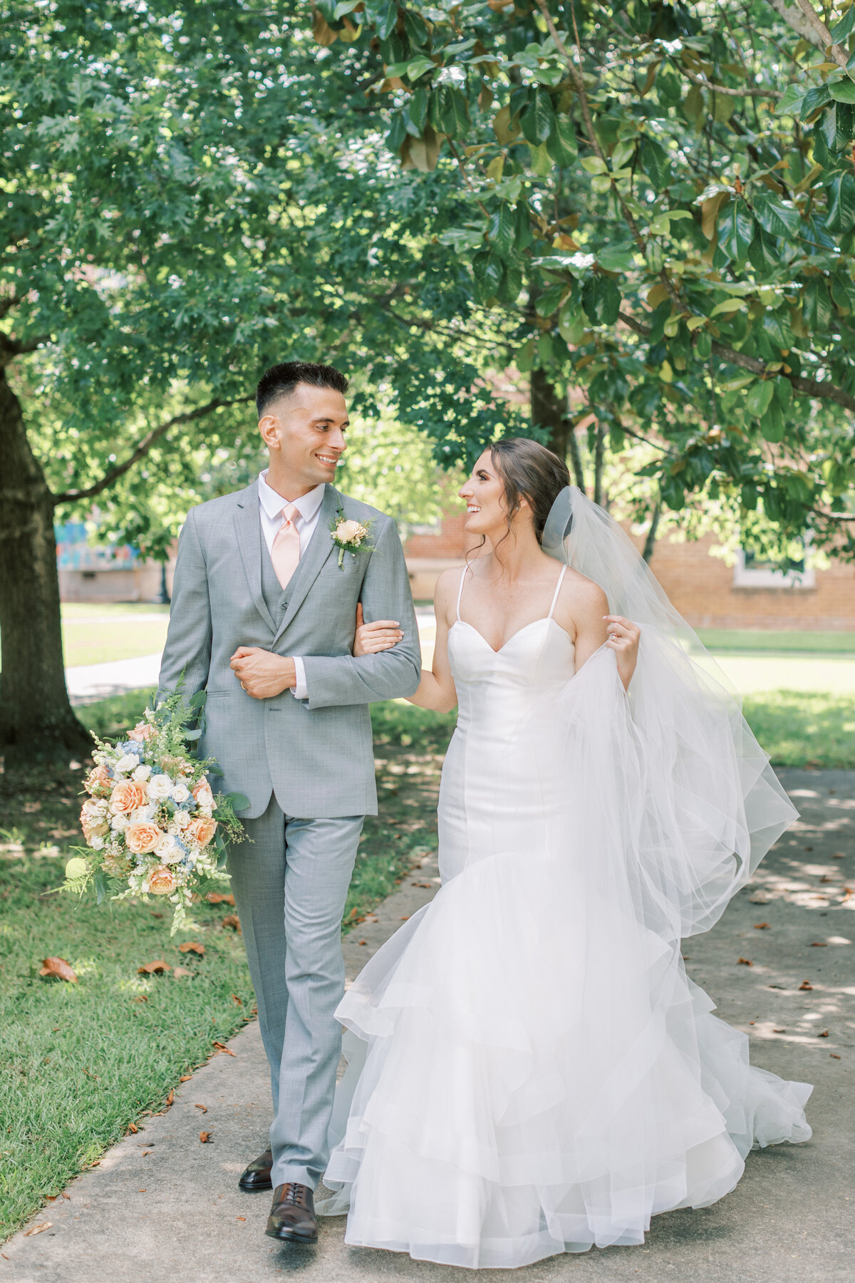 A husband and wife walk together after getting married.