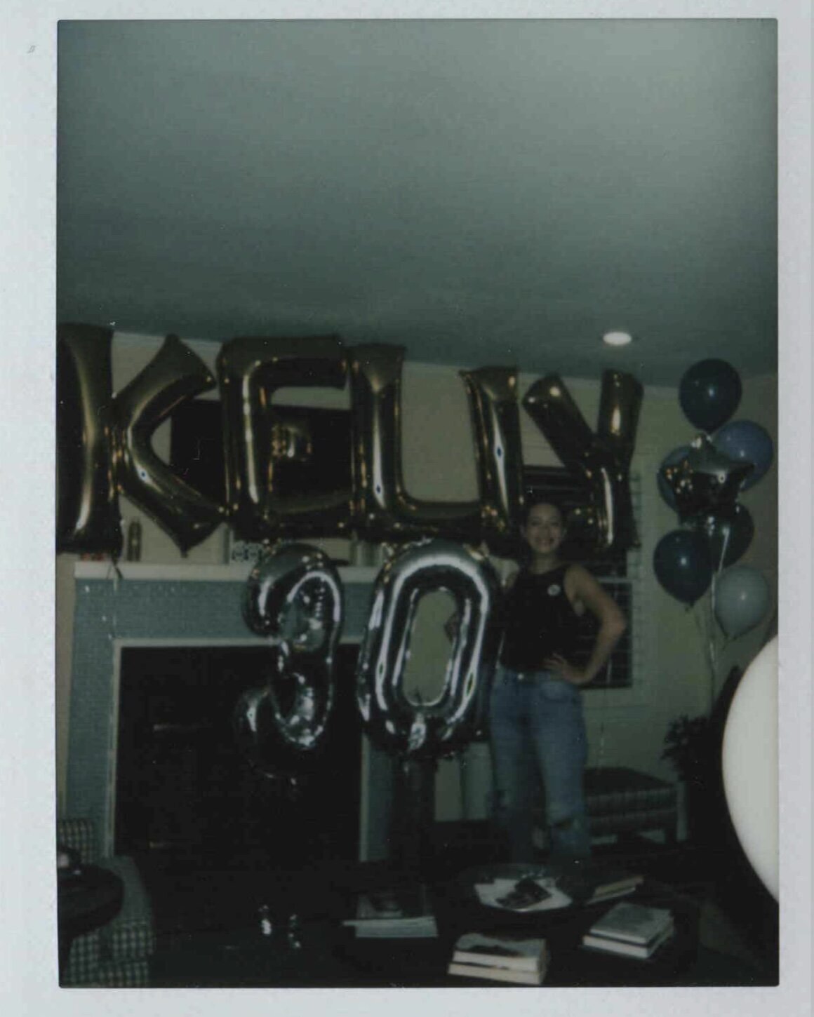 CASS IN FRONT OF KELLY SIGN
