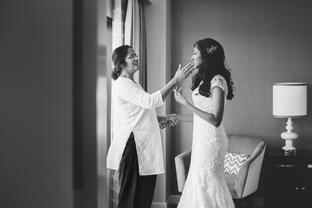 A mother has an emotional moment with her daughter on her wedding day.