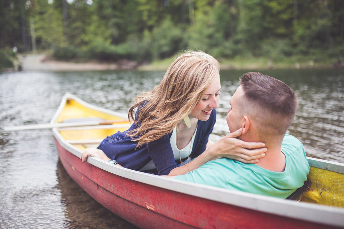 Vancouver Island engagement session with a couple in a canoe in the lake.
