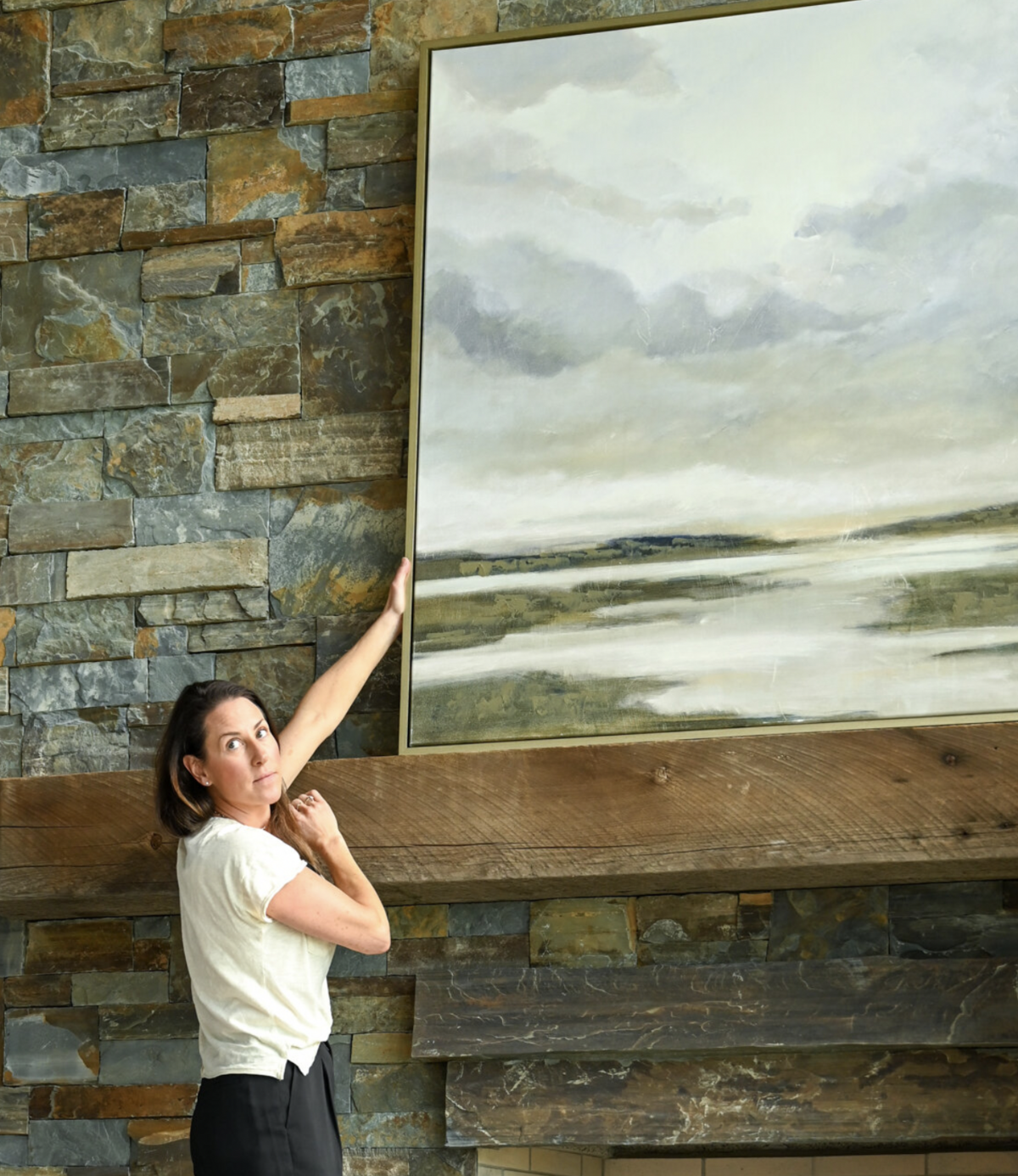 Kate installing a custom art piece at our Oden bay project.