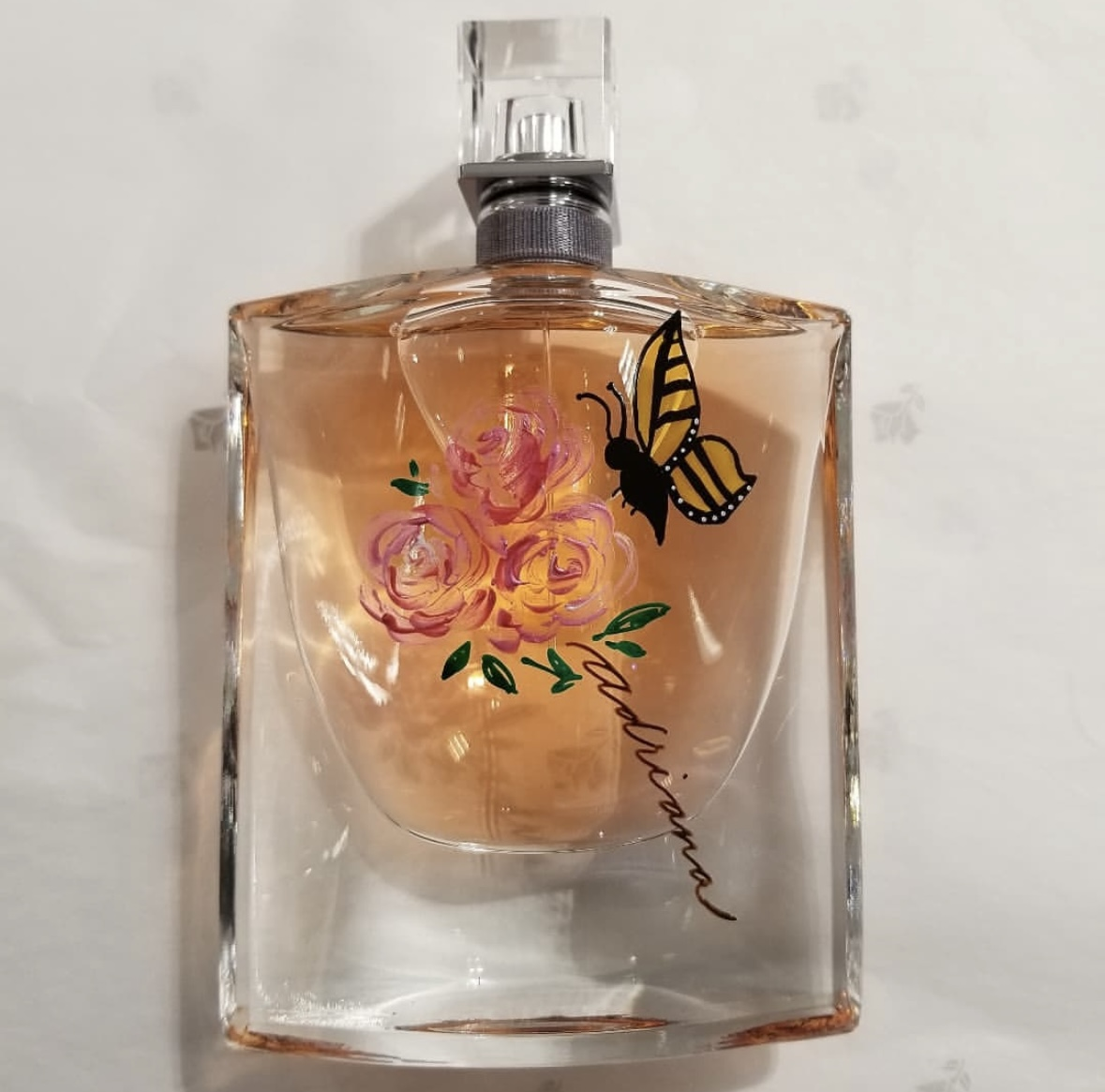 Bottle painting and calligraphy for Lancome fragrance during a store event by Toronto live painter Jenny Zhang