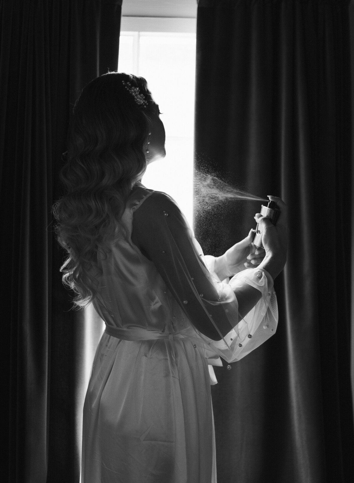 spraying perfume