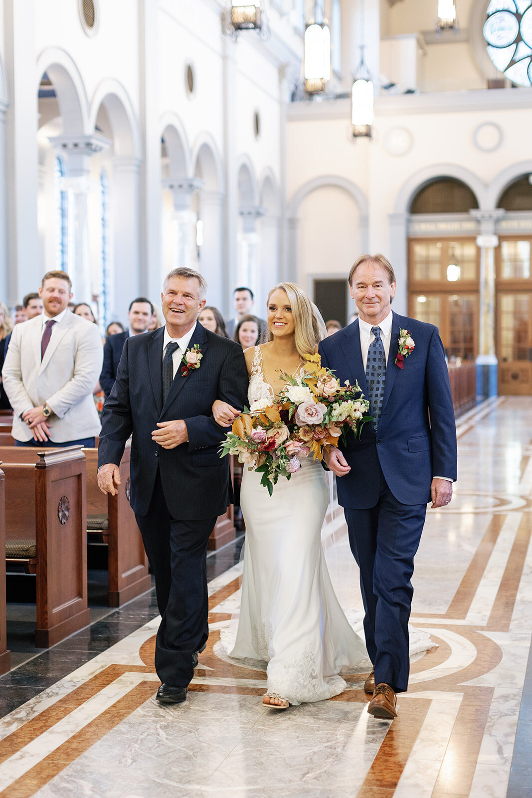 bride-walking-down-aisle-with-two-fathers