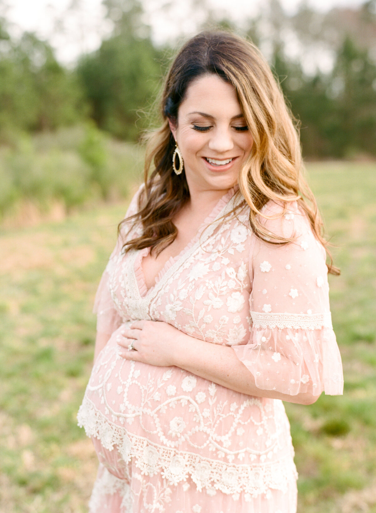 Mom looks lovingly over her expectant belly. Image by Raleigh maternity photographer A.J. Dunlap Photography.