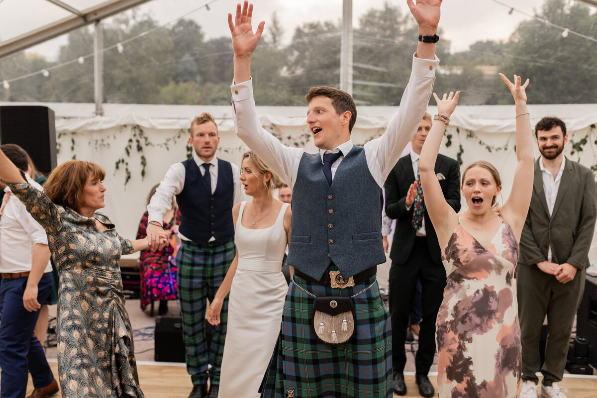 Ceilidh dancing at Devon marquee wedding