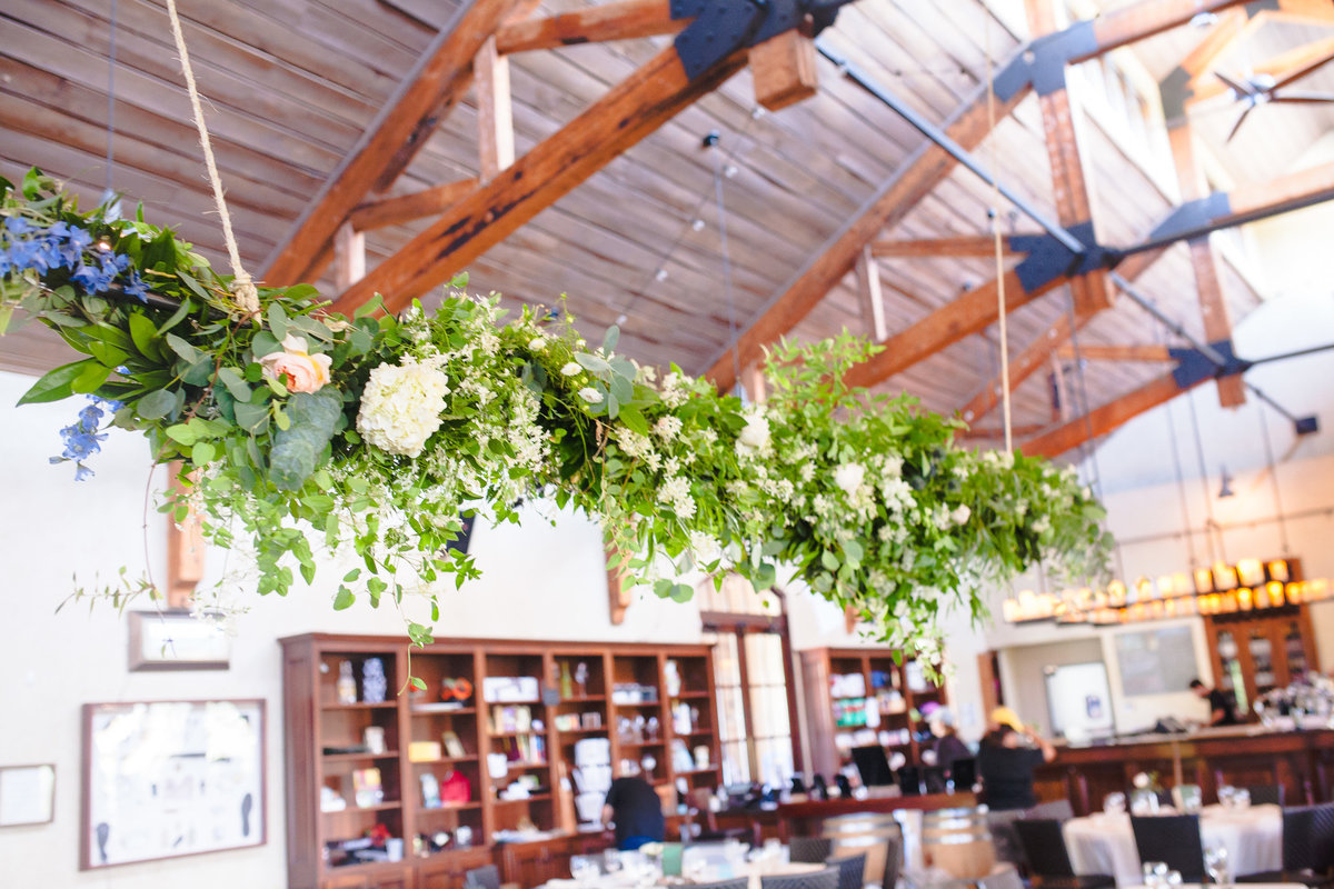 Flowers hang from the rafters at the banquet hall at the Chandler Hill Vineyard.