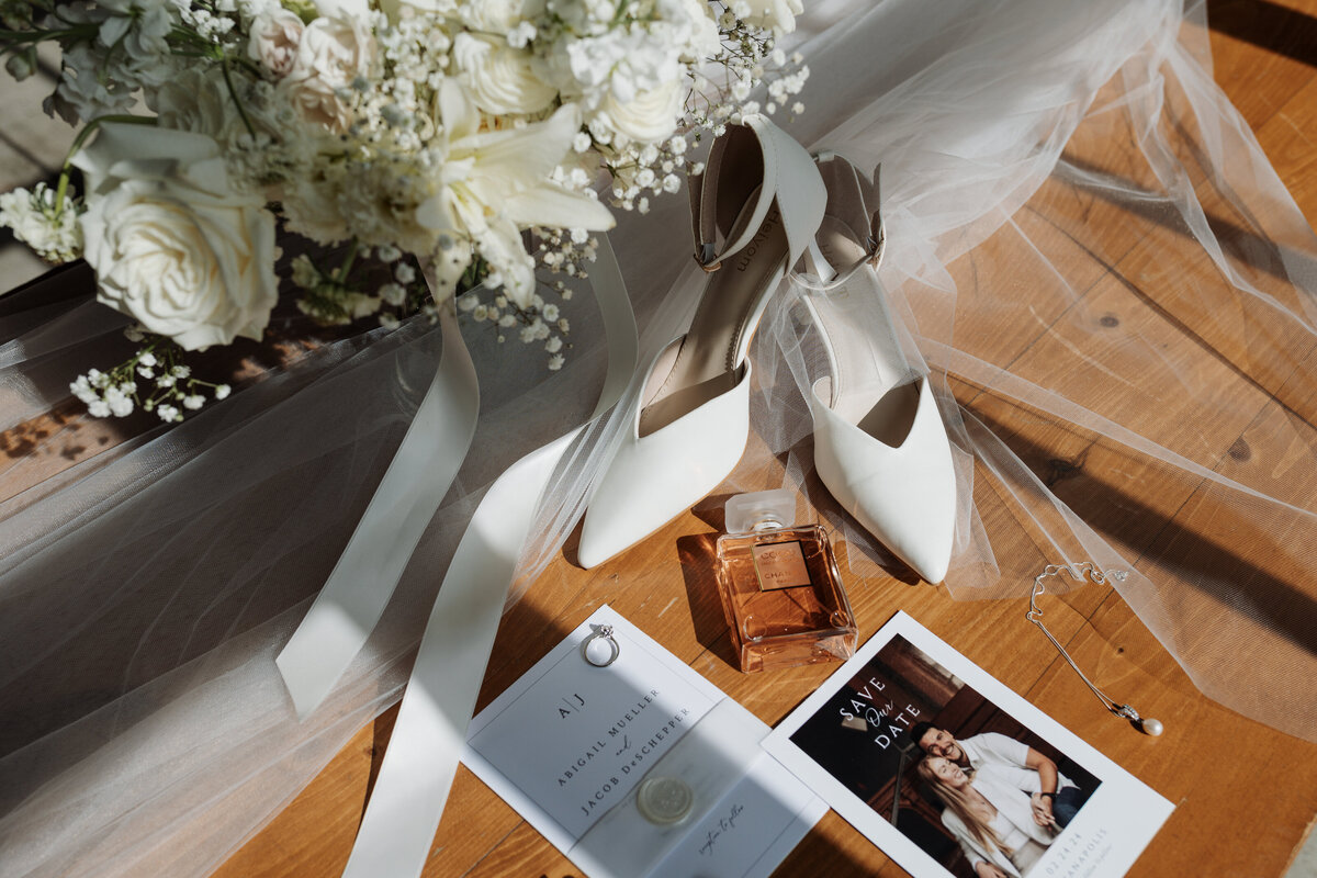 Bride's wedding details, including dress and rings, captured by Ryann B Photography, an Indianapolis wedding photographer.