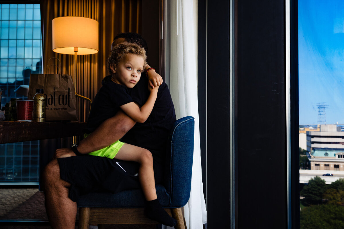One of the top wedding photos of 2021. Taken by Adore Wedding Photography- Toledo, Ohio Wedding Photographers. This photo is of child getting ready before the wedding ceremony in Toledo Ohio