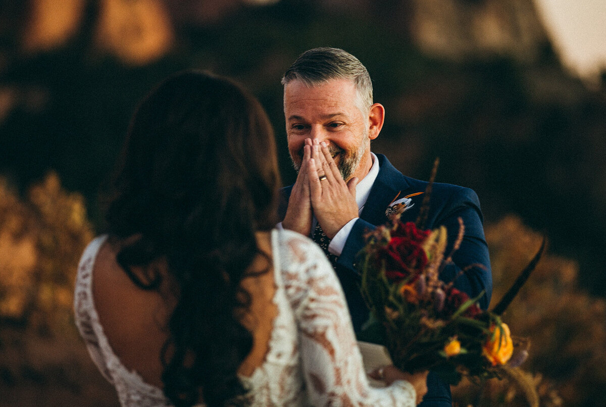 groom reacts to seeing bride for first time at garden of the gods