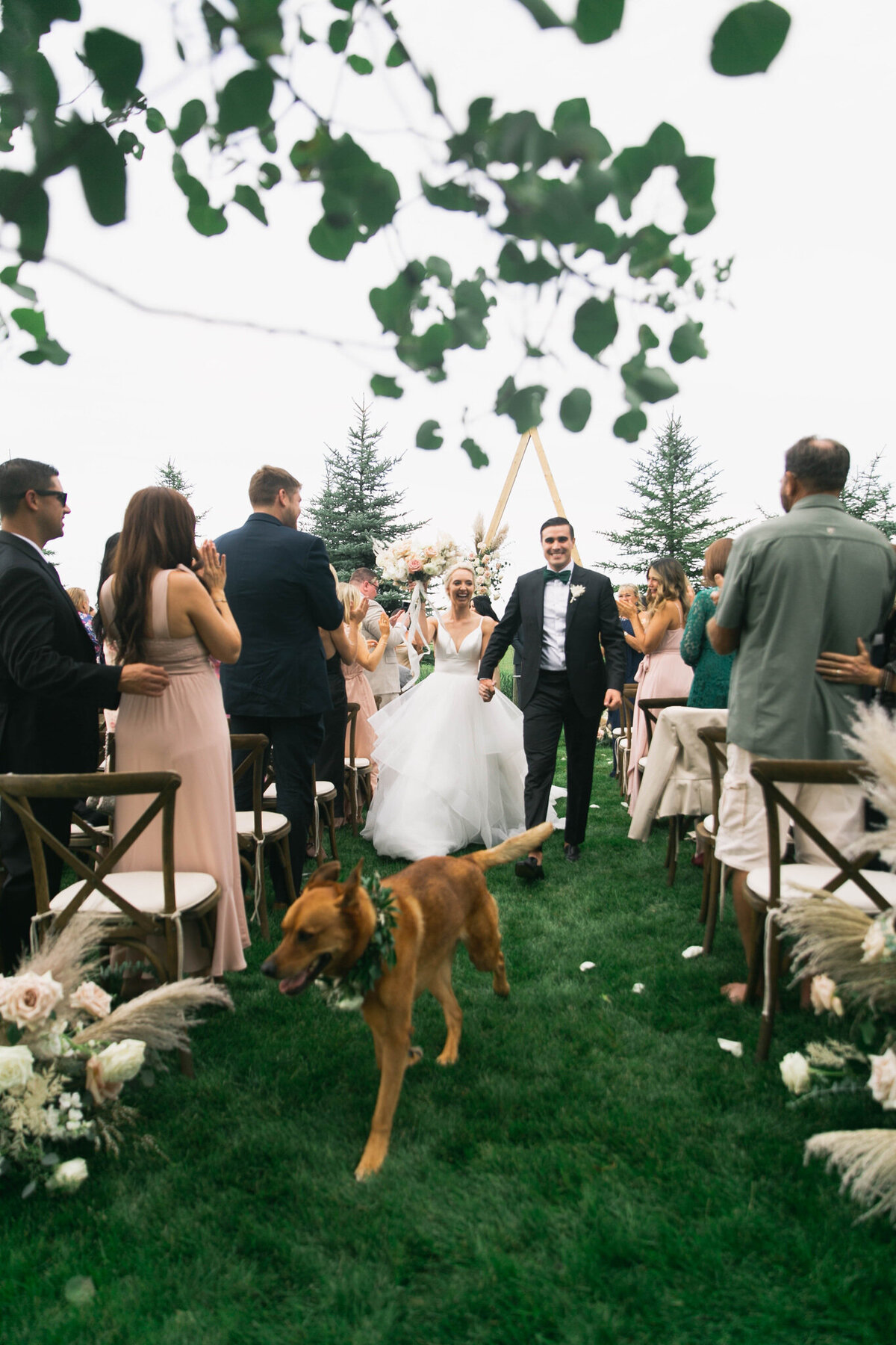bride and groom holding hands