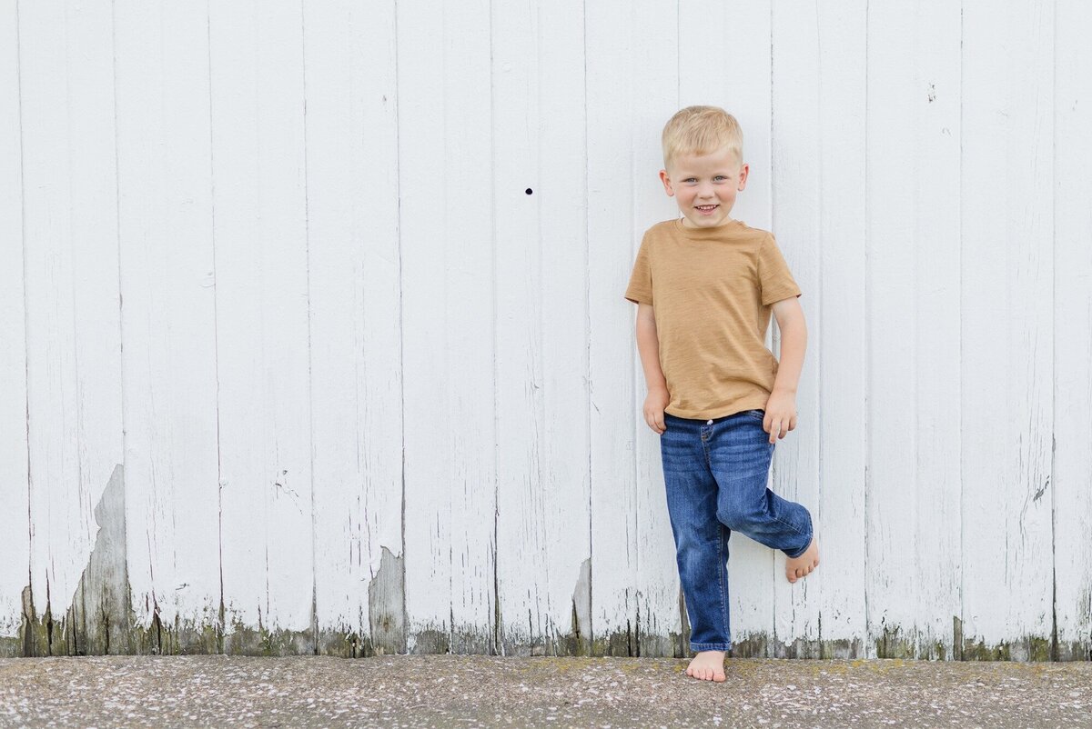 downing-boy-against-white-ohio-fence
