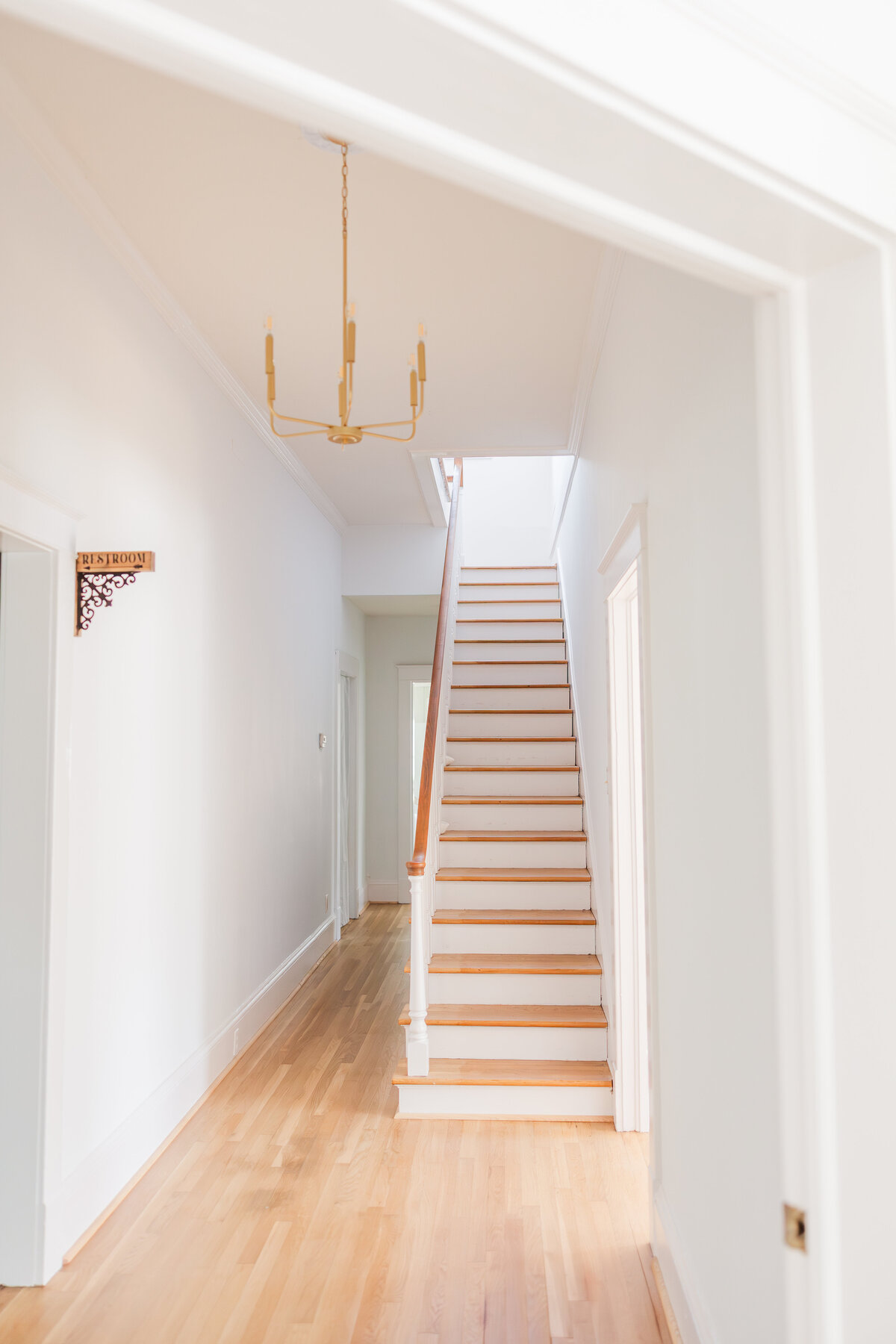 A white and neutral wooden staircase