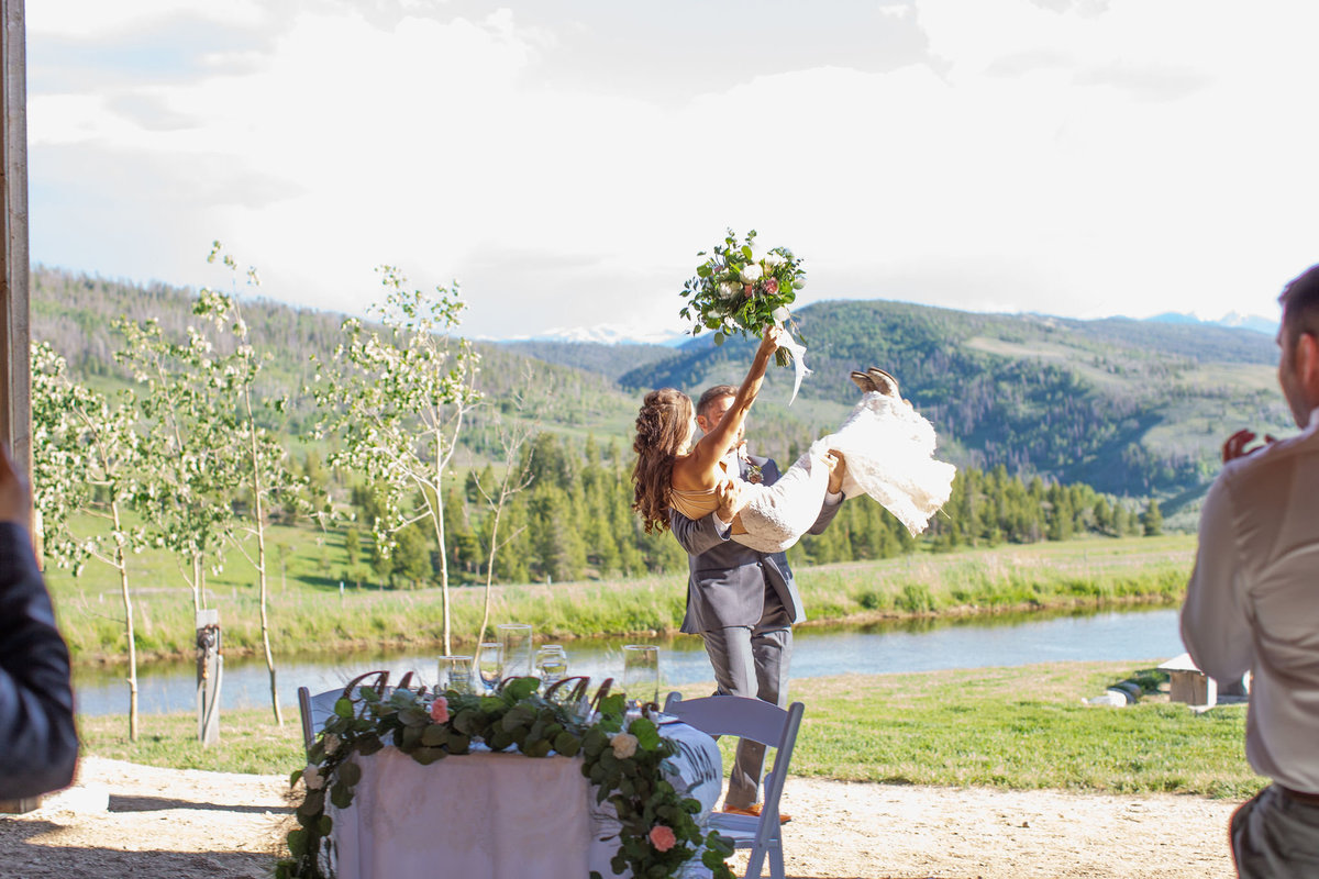 Strawberry-Creek-Ranch-Wedding-Ashley-McKenzie-Photography-Summer-love-on-the-ranch-Groom-carries-bride
