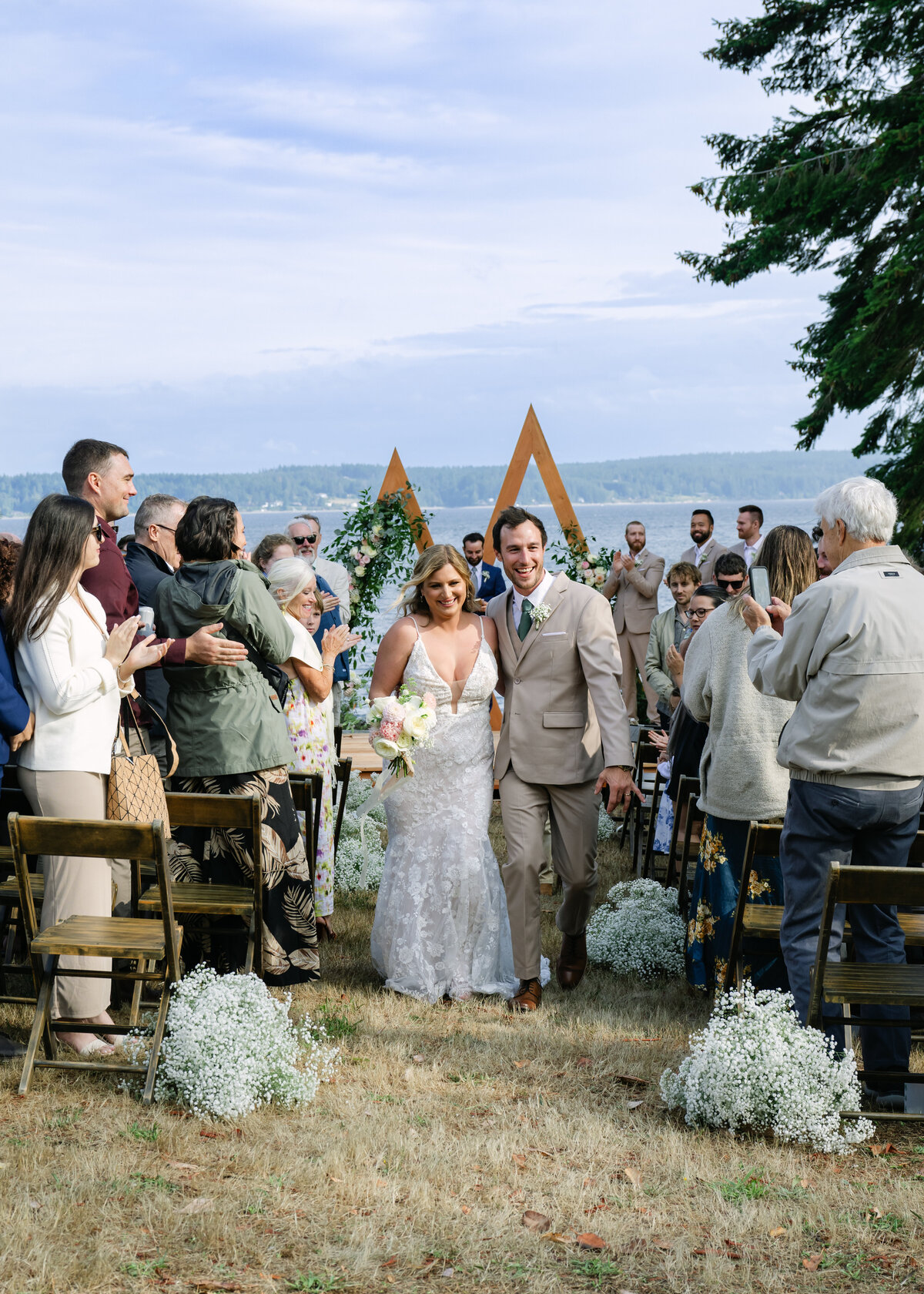 beach wedding just married with view of puget sound