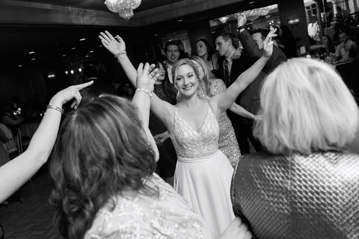 The Shore Club Bride dancing with hands in air
