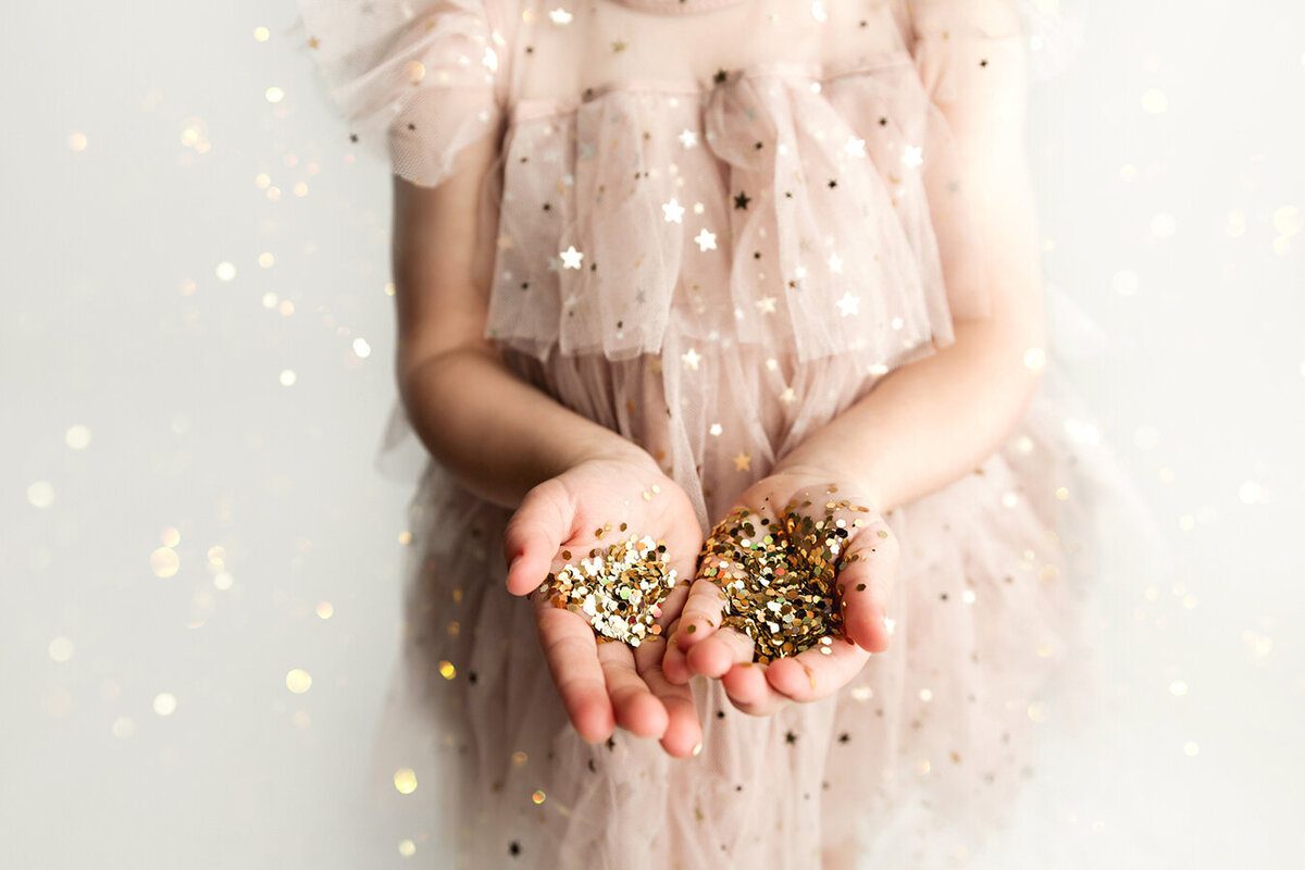 Hands full of glitter in Fort Collins, CO studio