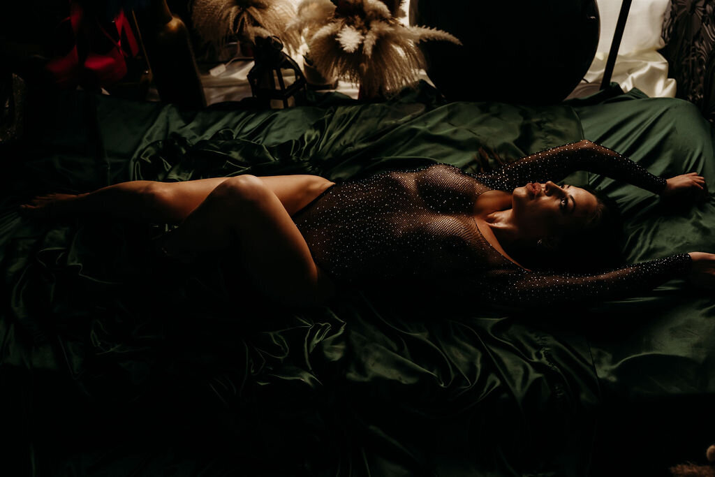 Boudoir photography woman in black lingerie on bed with green sheets Lubbock, Texas Boudoir photographer in Amarillo TX