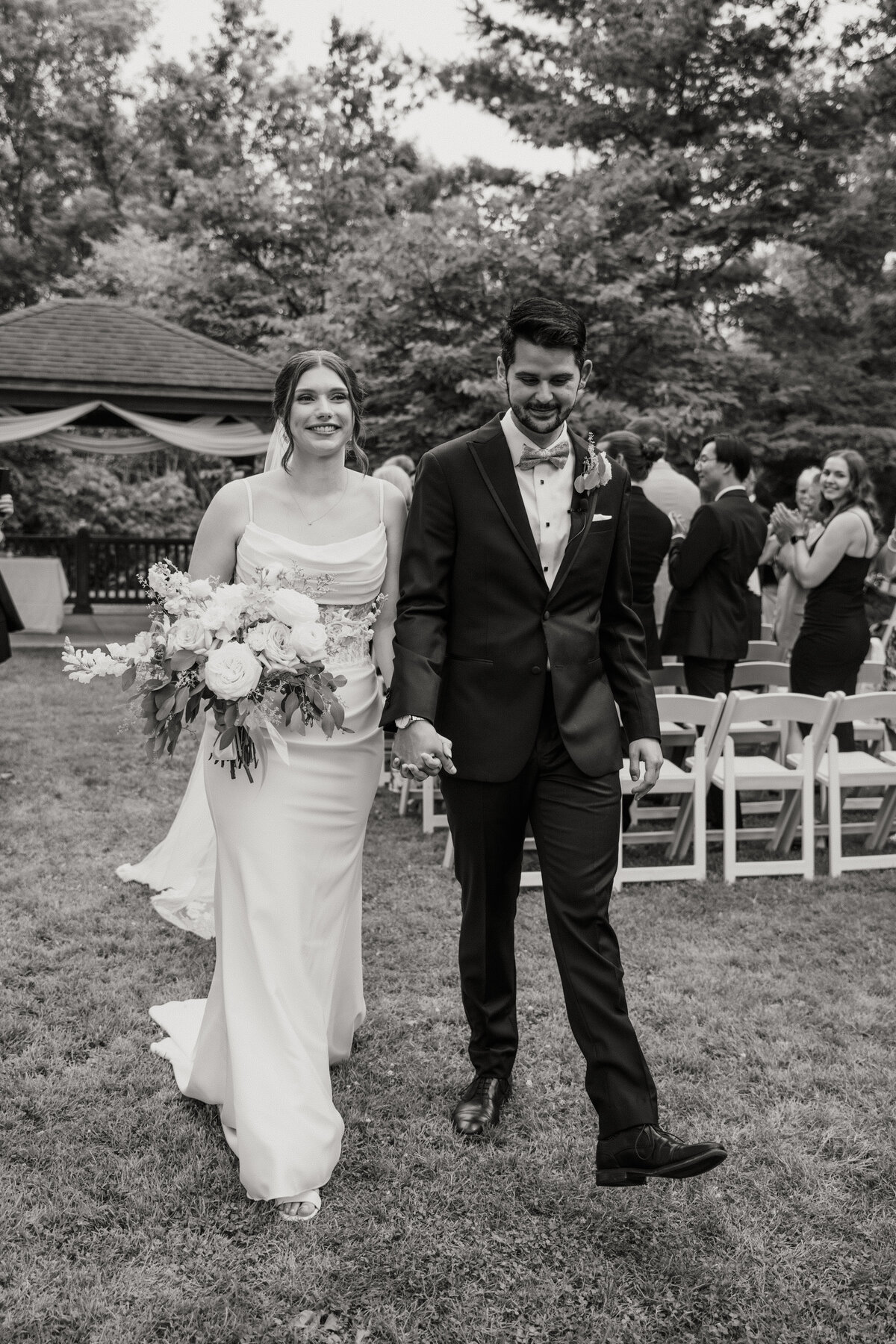 documentary style wedding photography of bride walking on the beach