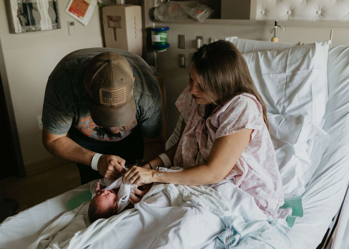 A new dad changes his baby’s diaper at Magee Women’s Hospital in Pittsburgh.