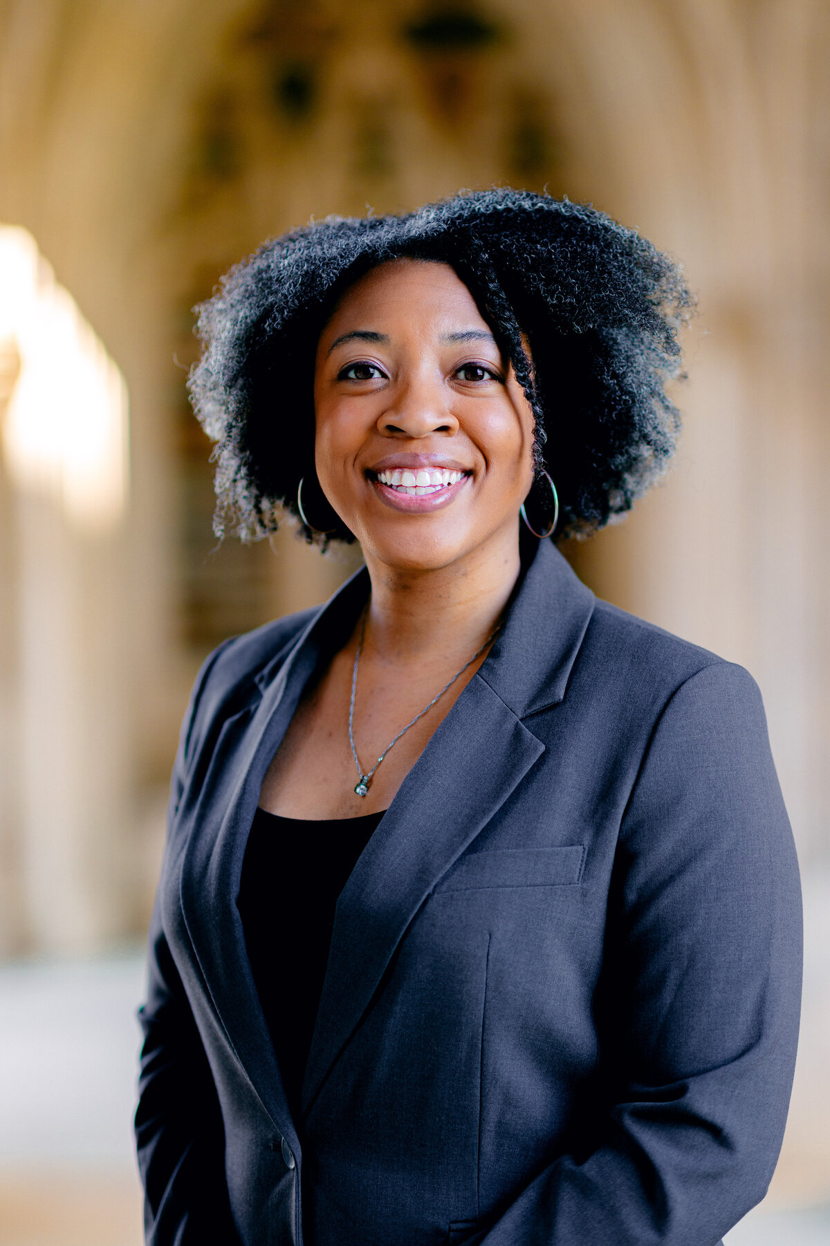 Woman smiling for headshot photo in professional clothing