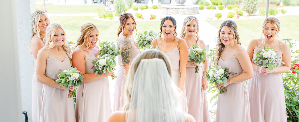 first-look-with-bridesmaids-bay-pointe-inn-wedding