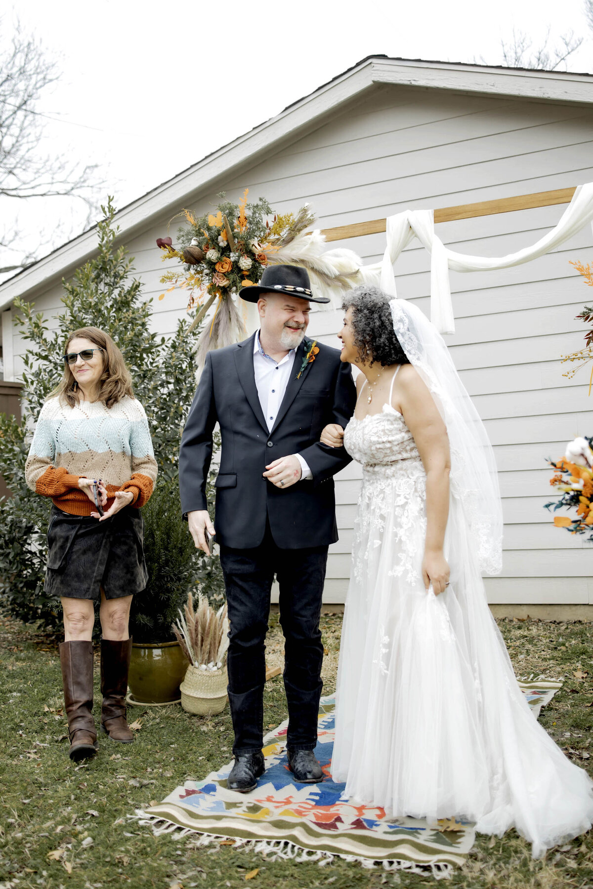 a bride and groom laugh at their small wedding in dallas texas