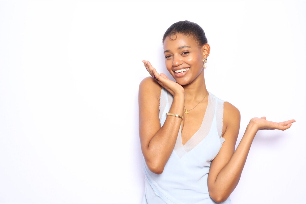 ar-photobooths-woman-smiling-blue-dress-white-background