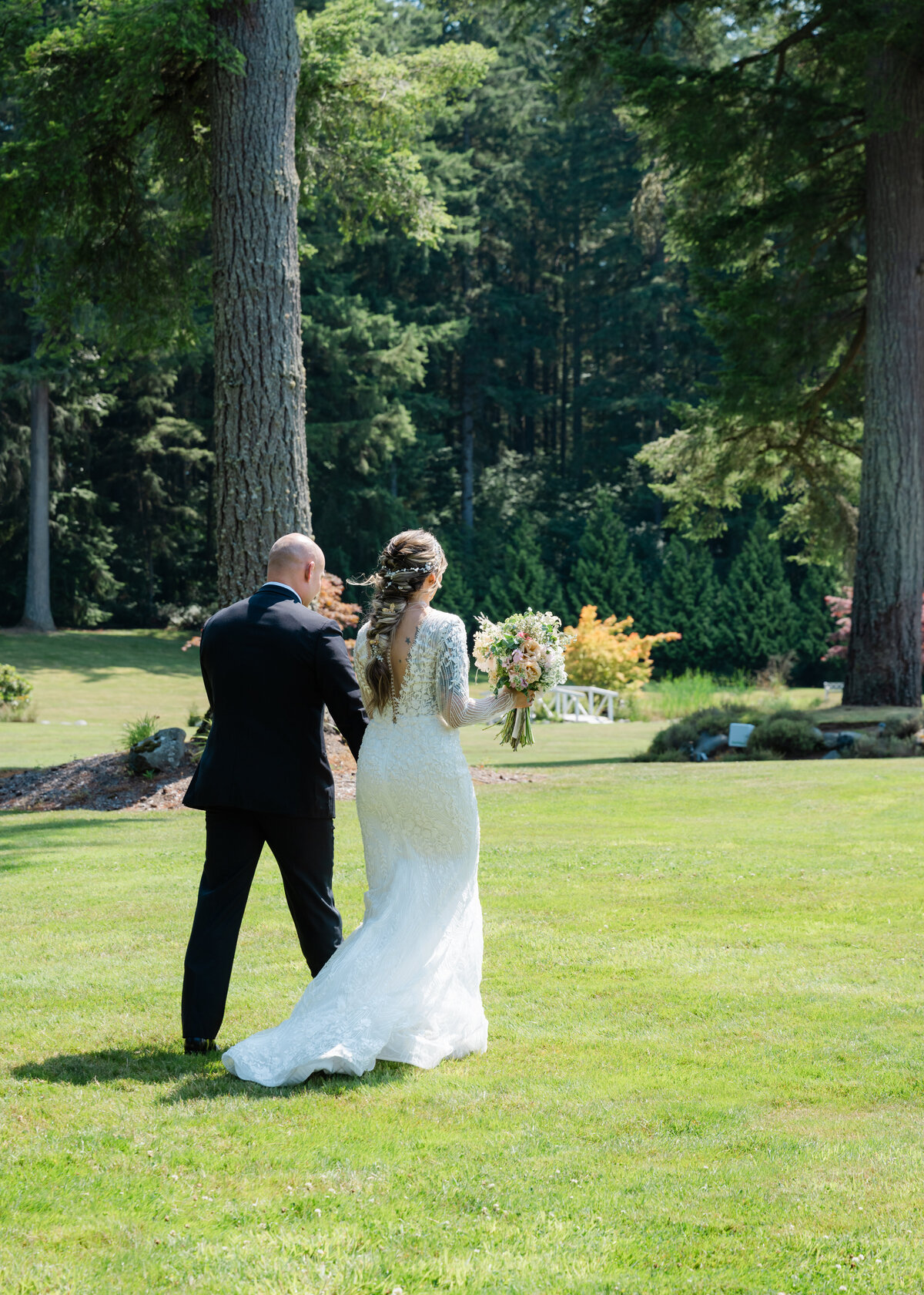 seattle garden wedding outdoors bride and groom walk to reception after vows