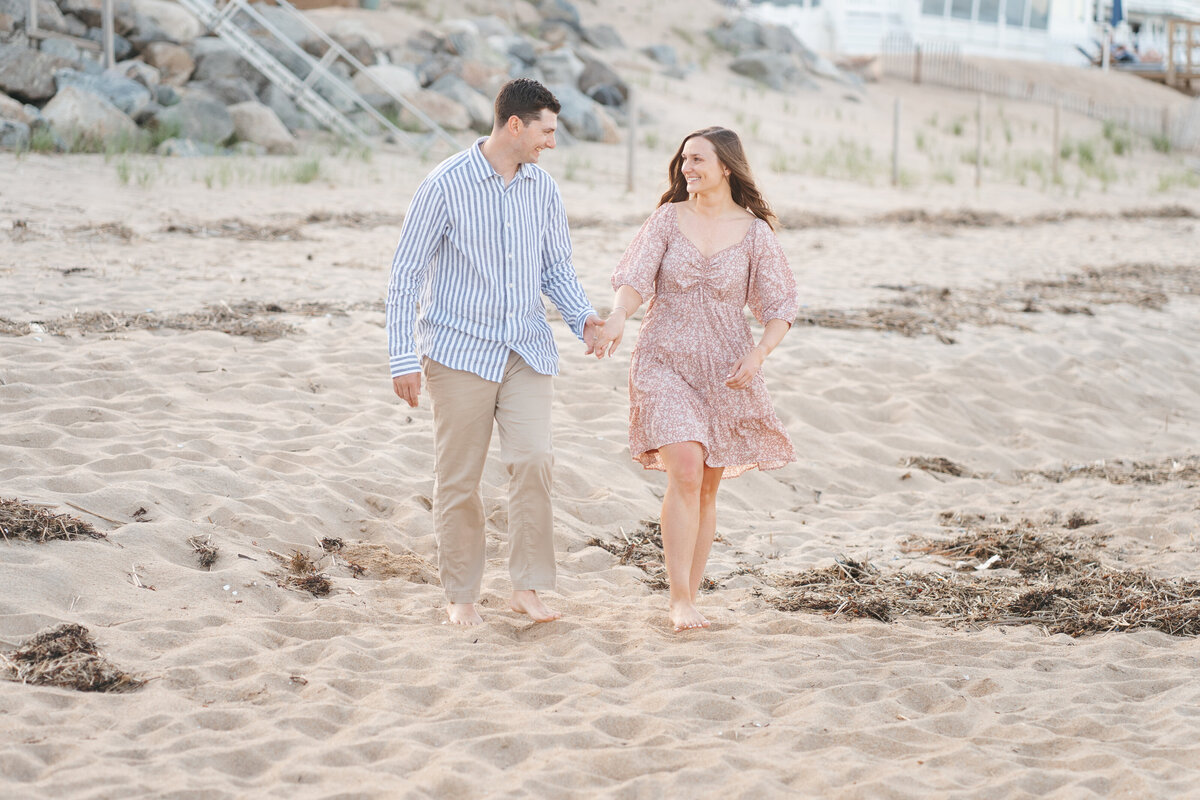 Natural and timeless engagement photos at the beach, capturing genuine moments by the ocean.