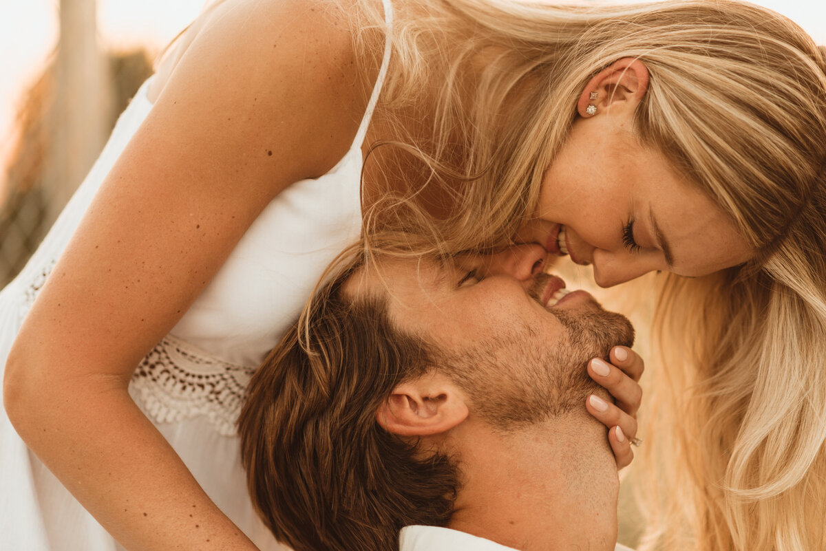 Couple embracing during a golden hour session in Pennsylvania, captured with warm, intimate light
