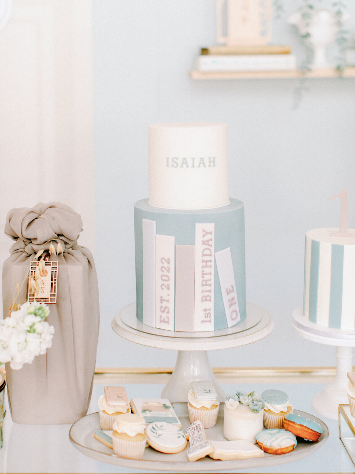 blue birthday cake with isaiah on it